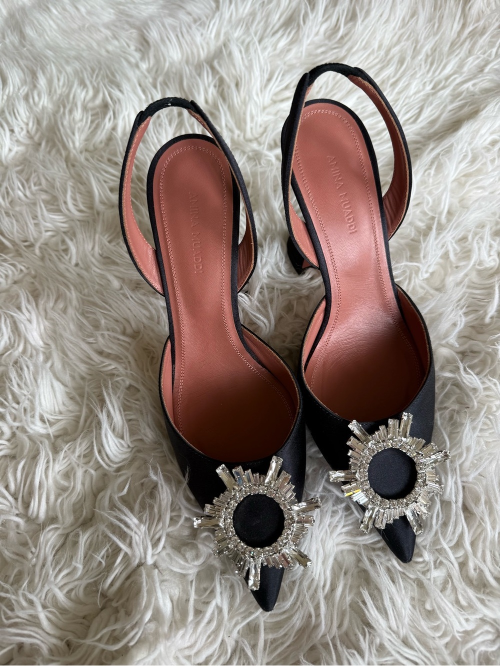 Amina Muaddi Black Pointed Slingback Pumps with Crystal Sunburst